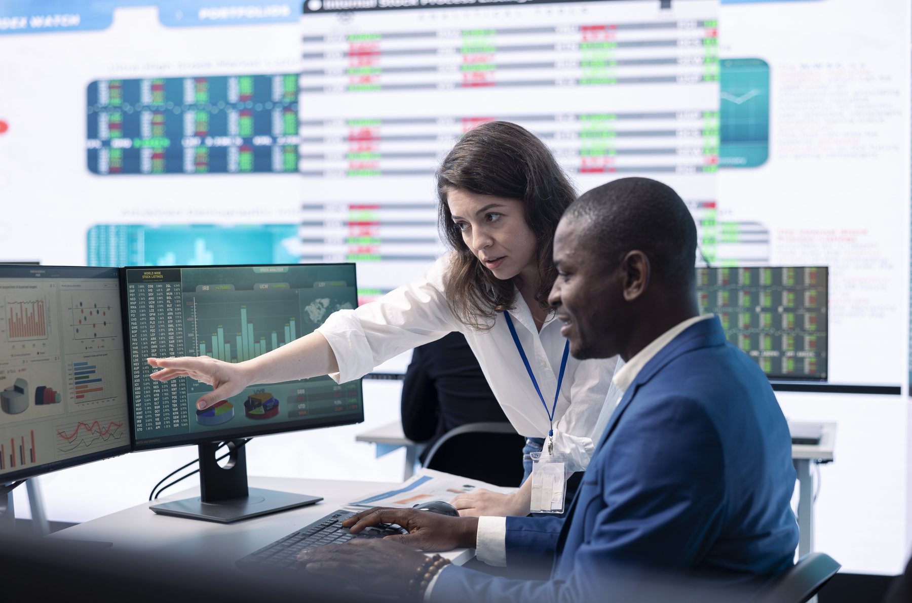 Professional team evaluating organisational statistics during a risk discussion